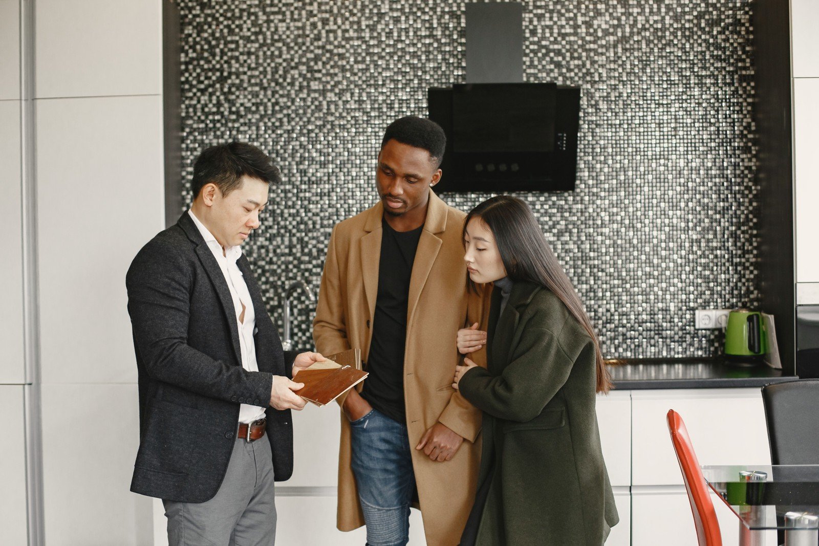 Adviser discussing kitchen options with customers